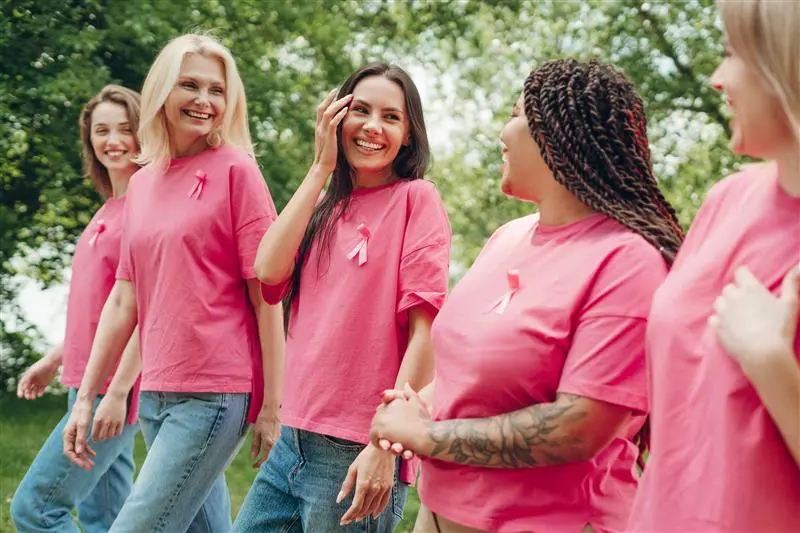 Women with pink t-shirts walking